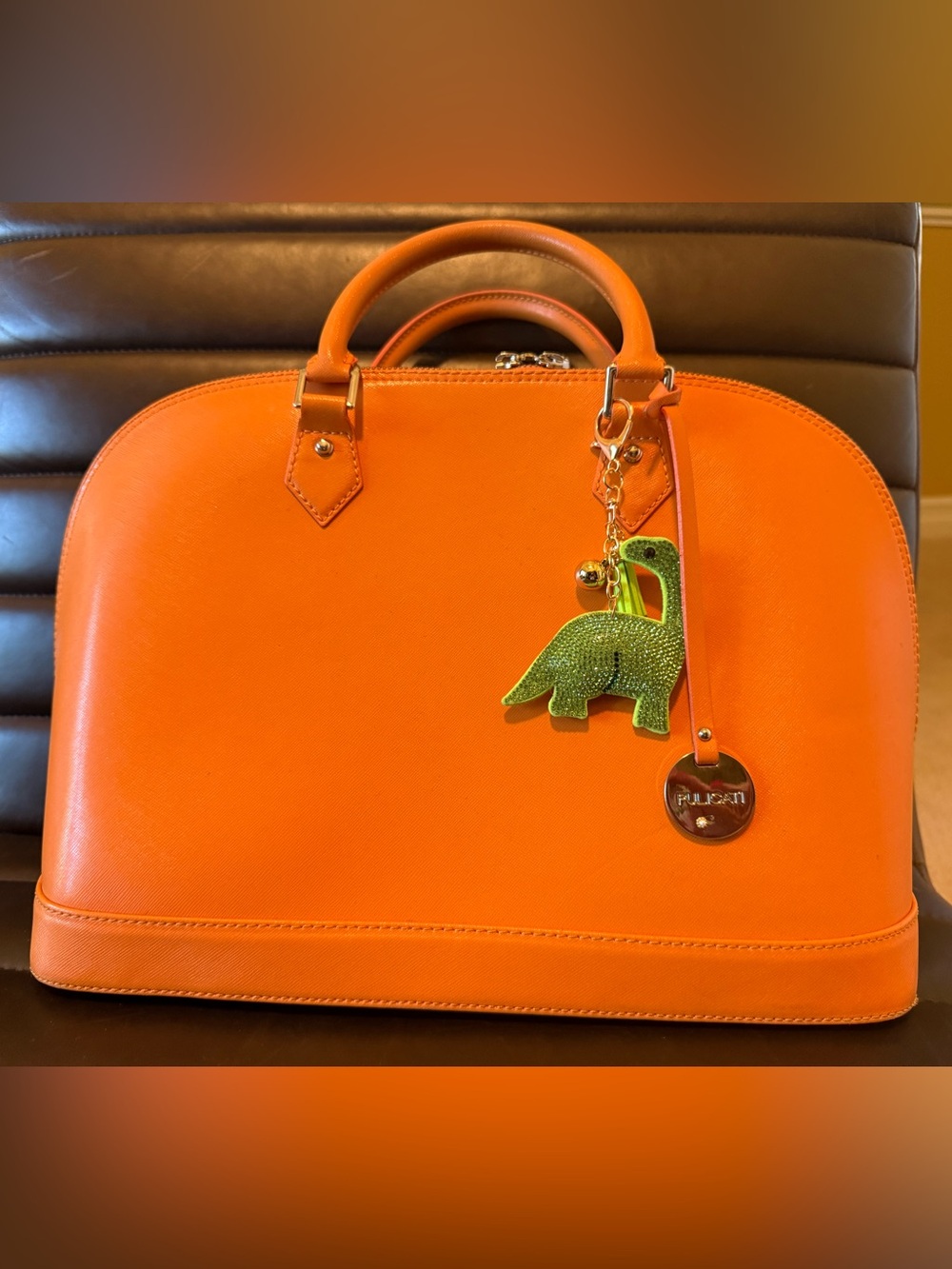Pulicati Orange Dome Satchel with Green Dinosaur Charm